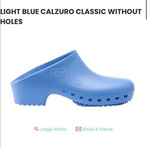 Light blue Calzuro clogs with out top holes. Excellent condition.